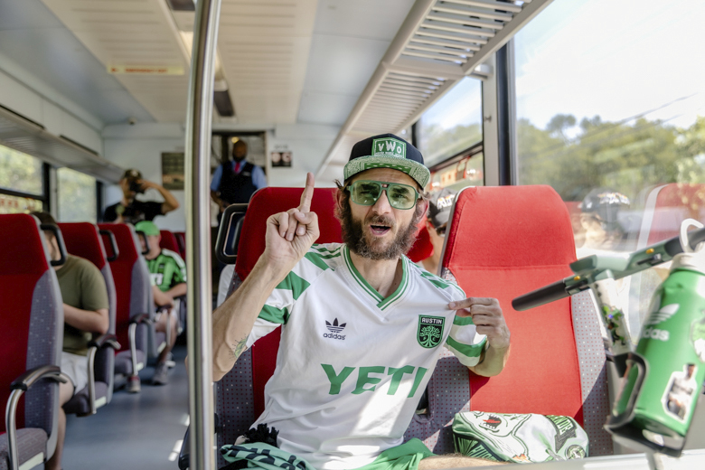 q2-fan-on-the-train Q2 Fan Riding the Train