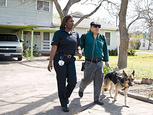 MetroAccess customer with service animal being escorted