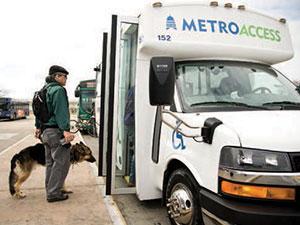 section2-customer-with-a-service-animal-boarding-MetroAccess-bus