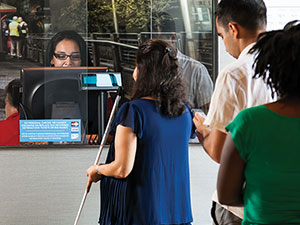 customers buying tickets and passes at the downtown Transit Store