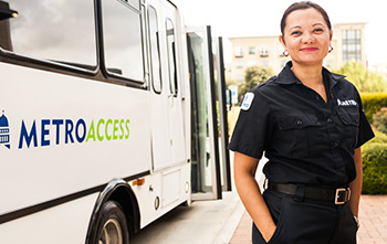 section9-MetroAccess-vehicle-operator-with-a-MetroAccess-mini-van-in-the-background